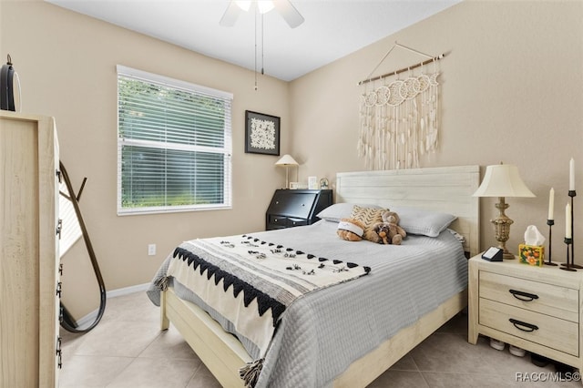 bedroom with ceiling fan and light tile patterned floors