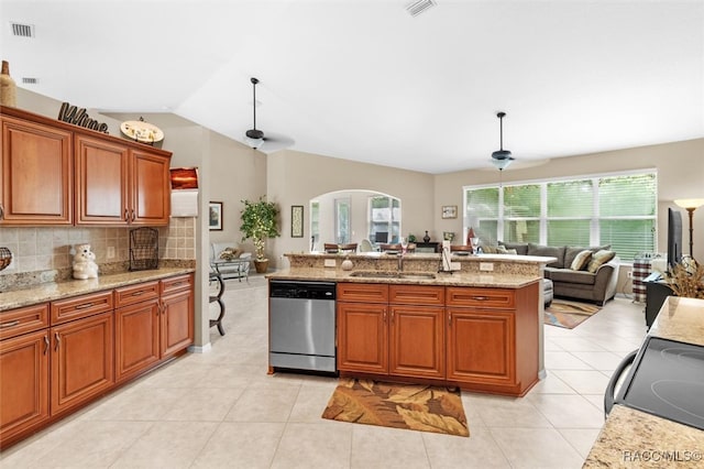 kitchen featuring backsplash, ceiling fan, sink, dishwasher, and range