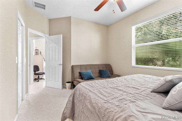 bedroom featuring light carpet and ceiling fan