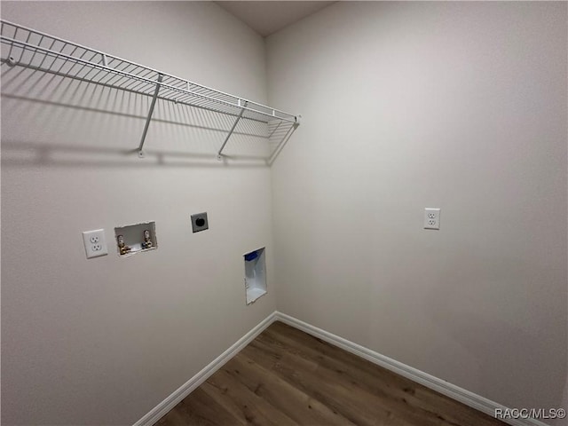 washroom featuring washer hookup, dark hardwood / wood-style floors, and hookup for an electric dryer