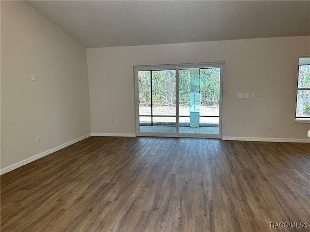 unfurnished room featuring dark hardwood / wood-style floors