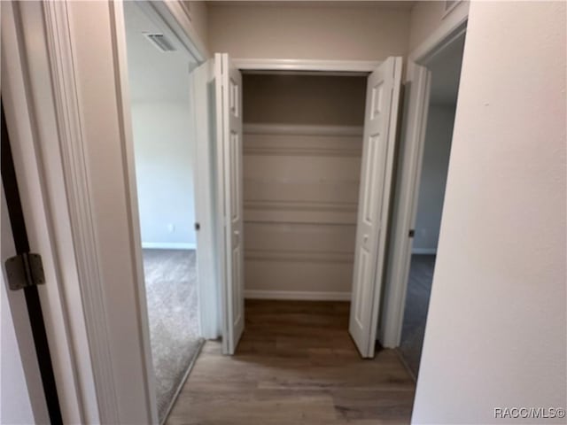 hallway with light wood-type flooring