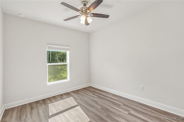 spare room featuring ceiling fan and light hardwood / wood-style flooring