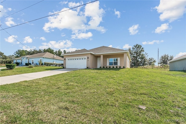 view of front of home with a front yard and a garage