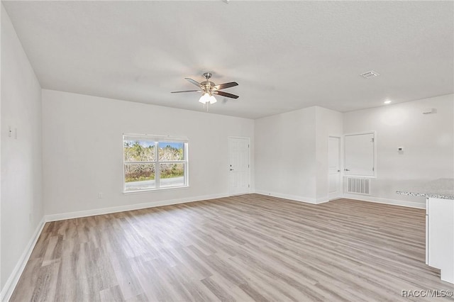 44 W Lynnhaven Pl, Citrus Springs, FL 34434 - unfurnished room featuring ceiling fan, light wood-type flooring, and baseboards