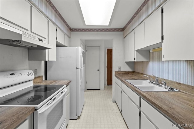 kitchen featuring a sink, white cabinetry, light floors, under cabinet range hood, and white electric stove
