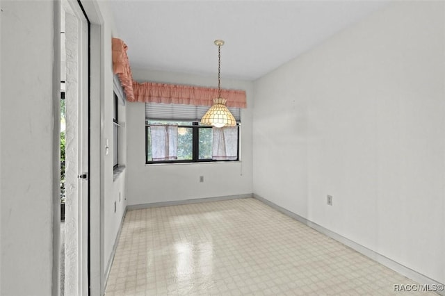 empty room with baseboards