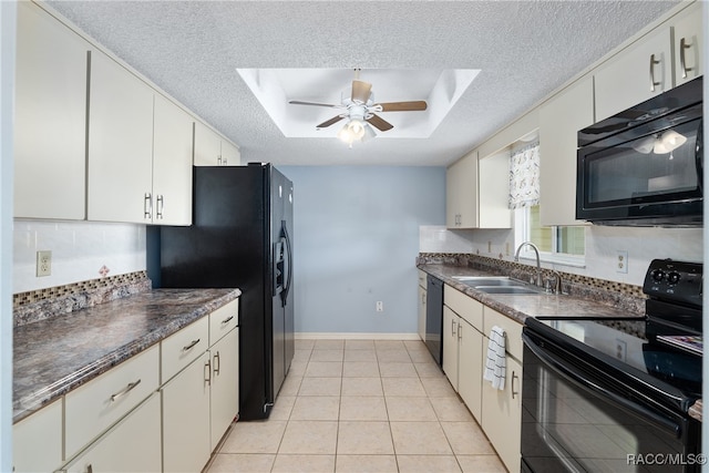 kitchen with black appliances, white cabinetry, sink, and a textured ceiling