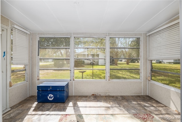 unfurnished sunroom with vaulted ceiling