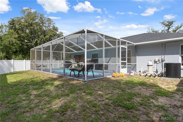 140 W Frisco Ln, Citrus Springs, FL 34434 - rear view of property featuring a fenced backyard, stucco siding, a patio, and glass enclosure