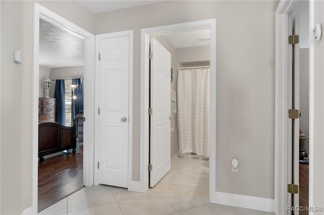 140 W Frisco Ln, Citrus Springs, FL 34434 - corridor with light tile patterned floors and baseboards