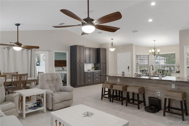 140 W Frisco Ln, Citrus Springs, FL 34434 - living area featuring a ceiling fan, lofted ceiling, a chandelier, recessed lighting, and light tile patterned floors