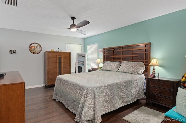 140 W Frisco Ln, Citrus Springs, FL 34434 - bedroom with dark wood finished floors and ceiling fan