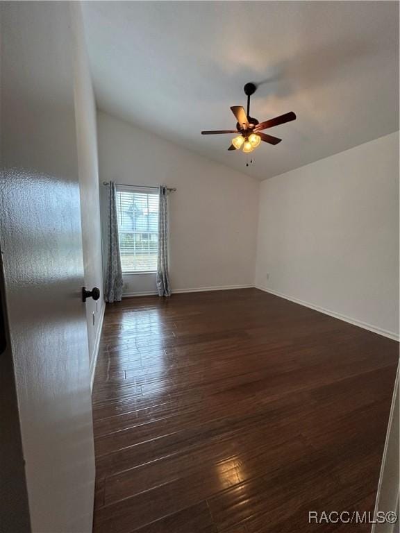 unfurnished room with dark hardwood / wood-style floors and ceiling fan