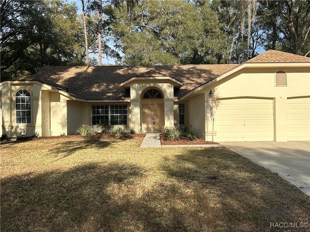 single story home featuring a front lawn