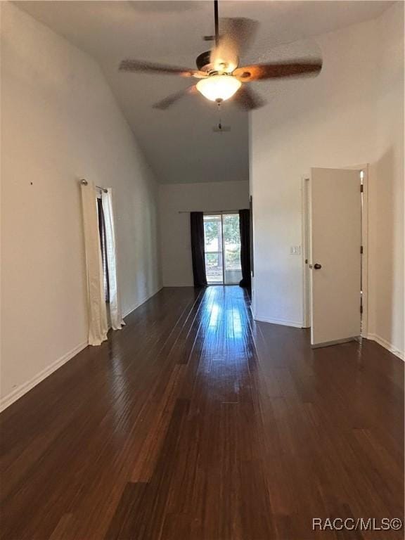 unfurnished room with lofted ceiling, dark hardwood / wood-style floors, and ceiling fan