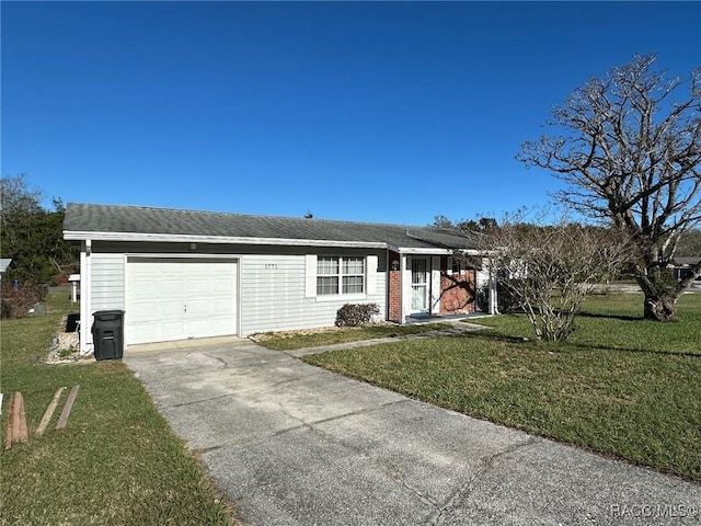 ranch-style home featuring a garage and a front lawn