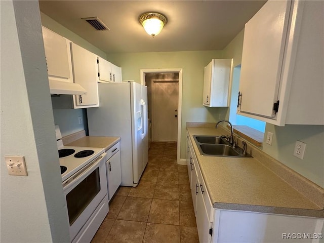 kitchen with white cabinetry, sink, tile patterned floors, and white appliances