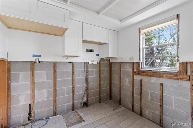 bathroom with a wainscoted wall