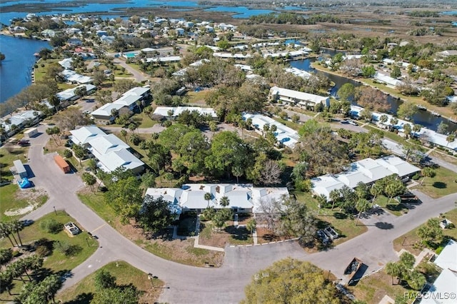 aerial view with a water view and a residential view