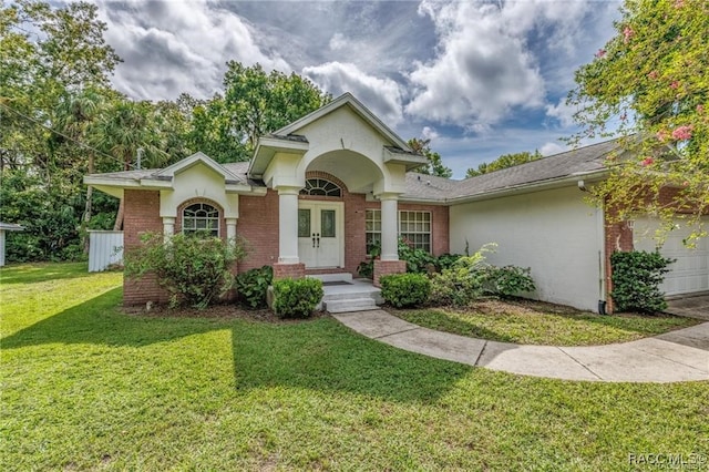 view of front of home featuring a front lawn and a garage