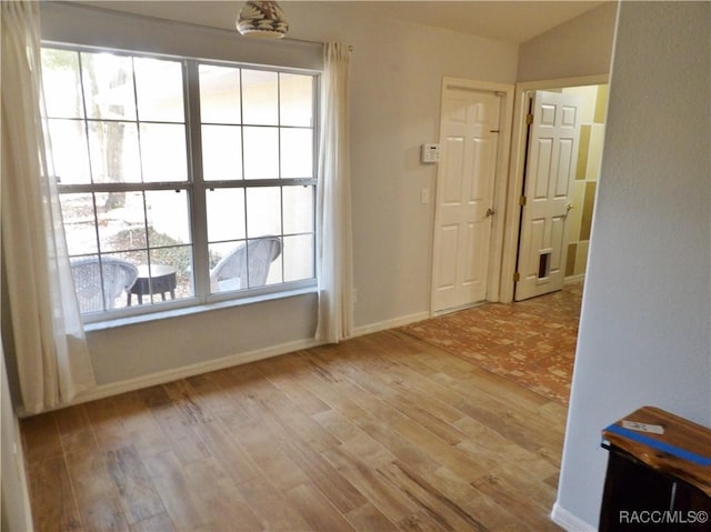 unfurnished room featuring light hardwood / wood-style flooring