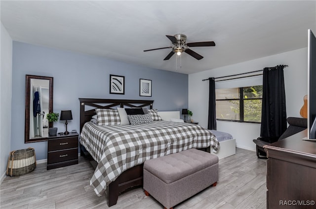 bedroom with ceiling fan and light wood-type flooring