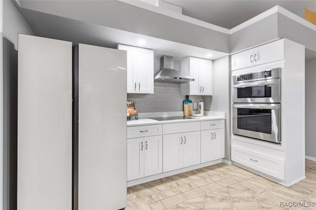 4105 W Tomahawk Dr, Beverly Hills, FL 34465 - kitchen with wall chimney exhaust hood, stainless steel double oven, black electric cooktop, light countertops, and white cabinetry