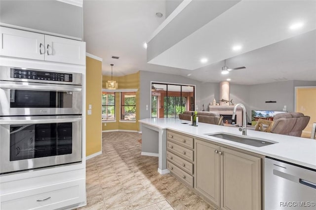 4105 W Tomahawk Dr, Beverly Hills, FL 34465 - kitchen featuring stainless steel appliances, open floor plan, light countertops, and ceiling fan