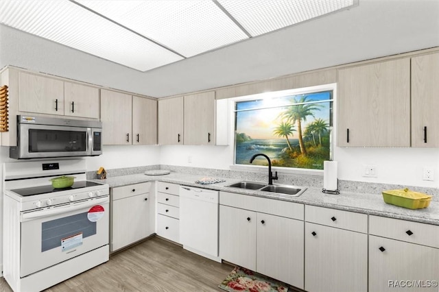 3874 N Timucua Pt, Crystal River, FL 34428 - kitchen with white appliances, light wood-type flooring, and light stone countertops