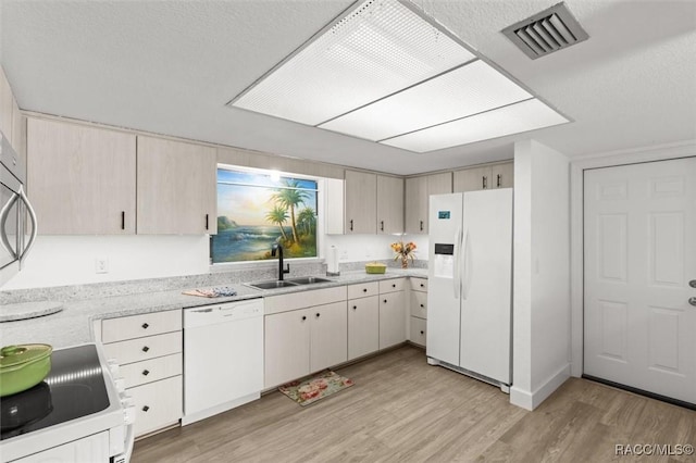 3874 N Timucua Pt, Crystal River, FL 34428 - kitchen featuring white appliances, light countertops, and light wood-type flooring
