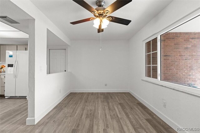 3874 N Timucua Pt, Crystal River, FL 34428 - empty room with wood finished floors and a ceiling fan