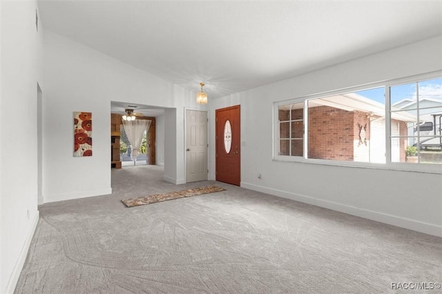3874 N Timucua Pt, Crystal River, FL 34428 - entrance foyer with carpet floors, plenty of natural light, and a ceiling fan