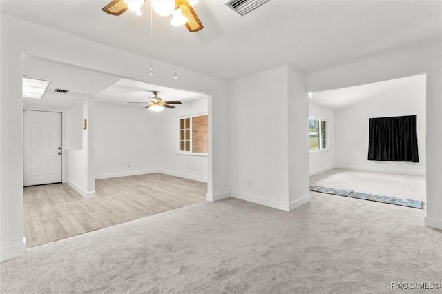 3874 N Timucua Pt, Crystal River, FL 34428 - unfurnished living room with a ceiling fan and carpet