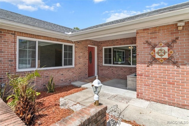 3874 N Timucua Pt, Crystal River, FL 34428 - doorway to property featuring brick siding