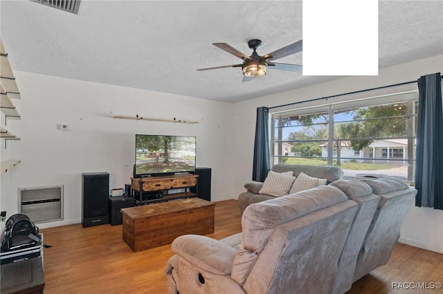 208 S Adams St, Beverly Hills, FL 34465 - living area with ceiling fan, a textured ceiling, and wood finished floors