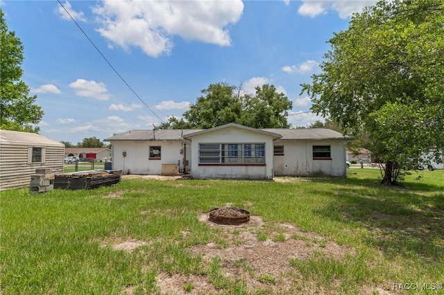 208 S Adams St, Beverly Hills, FL 34465 - rear view of property featuring a yard