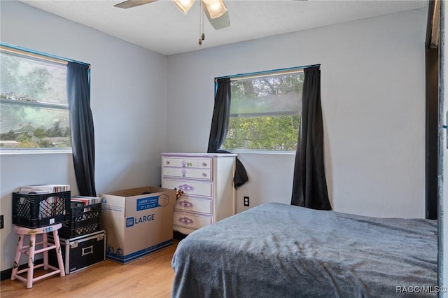 208 S Adams St, Beverly Hills, FL 34465 - bedroom with wood finished floors and ceiling fan