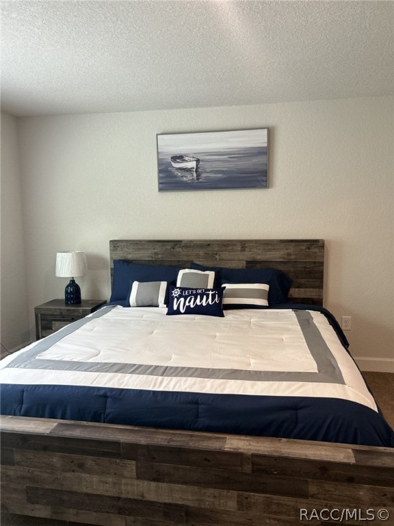 bedroom featuring a textured ceiling