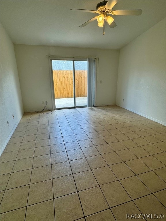 unfurnished room featuring ceiling fan and light tile patterned floors