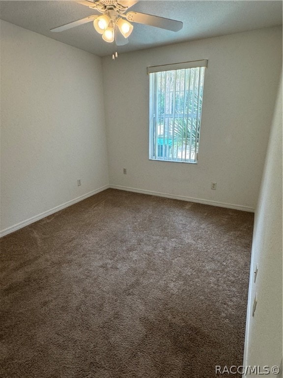 unfurnished room with carpet and ceiling fan