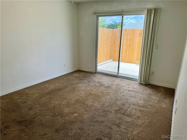 spare room featuring carpet flooring