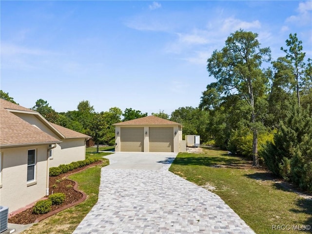 2056 W Learwood Pl, Beverly Hills, FL 34465 - surrounding community with a detached garage and a lawn