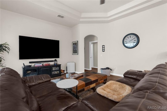 2056 W Learwood Pl, Beverly Hills, FL 34465 - living area featuring arched walkways, wood finished floors, a raised ceiling, and baseboards