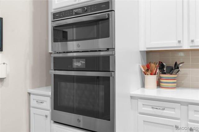 2056 W Learwood Pl, Beverly Hills, FL 34465 - kitchen featuring backsplash and white cabinetry