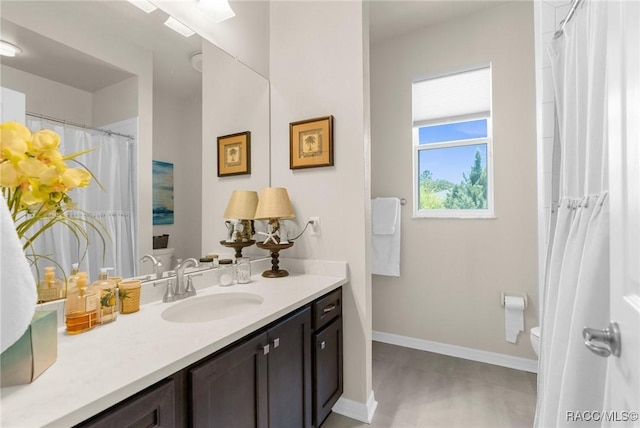 2056 W Learwood Pl, Beverly Hills, FL 34465 - bathroom featuring toilet, vanity, and baseboards