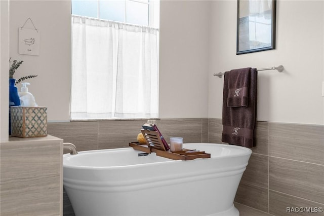 2056 W Learwood Pl, Beverly Hills, FL 34465 - full bath with tile walls, a freestanding bath, and a wainscoted wall