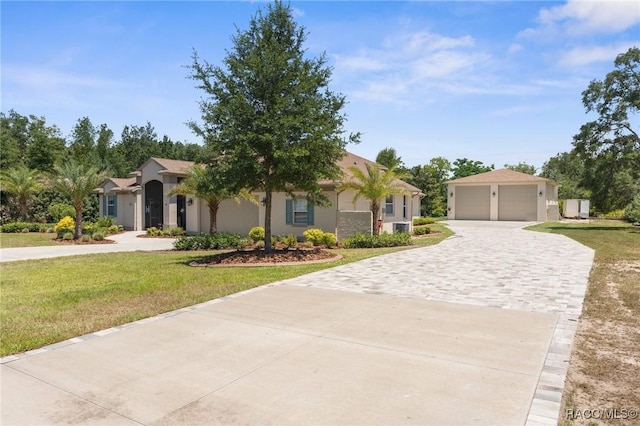 2056 W Learwood Pl, Beverly Hills, FL 34465 - view of front of home featuring a garage, a front yard, and stucco siding