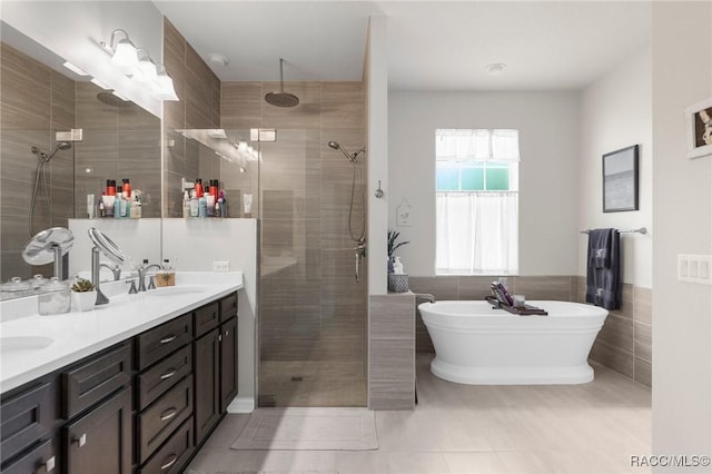 2056 W Learwood Pl, Beverly Hills, FL 34465 - full bathroom featuring tile walls, a tile shower, tile patterned flooring, double vanity, and a soaking tub