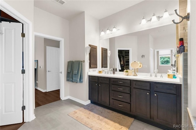 2056 W Learwood Pl, Beverly Hills, FL 34465 - full bath featuring double vanity and baseboards